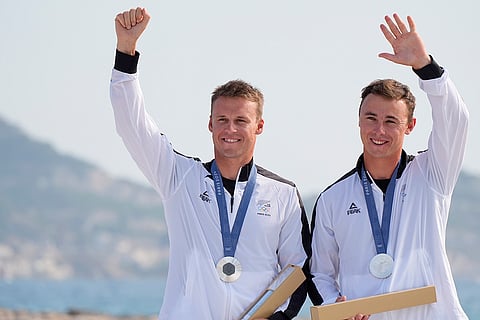 Silver medal winners Isaac McHardie and William McKenzie during men's skiff medal ceremony